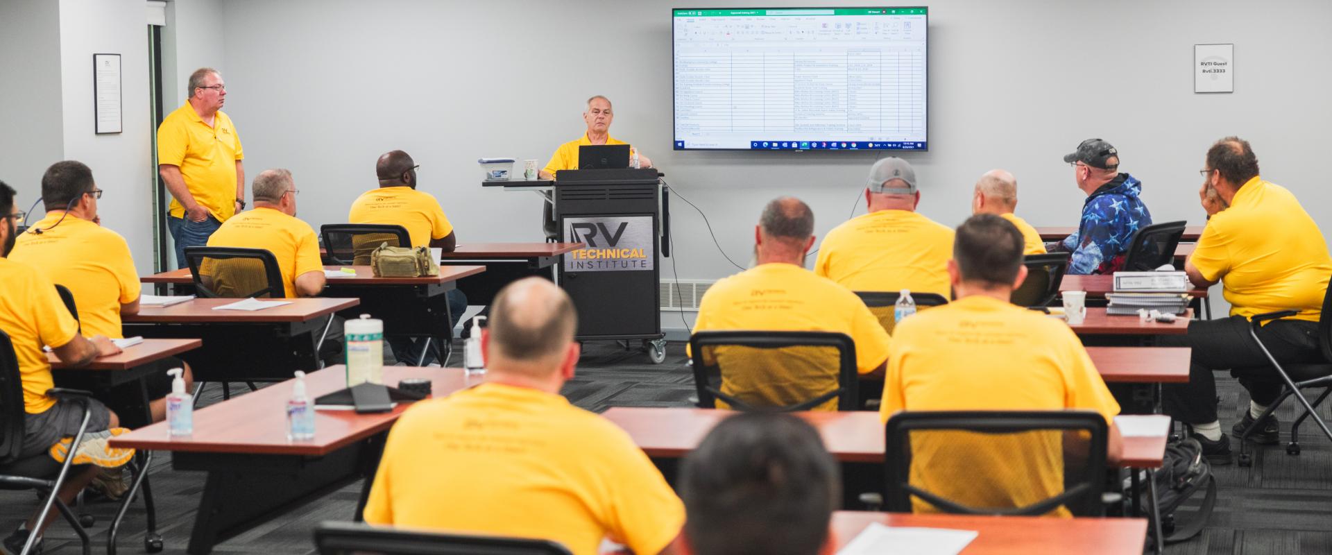 Technicians in a classroom lecture