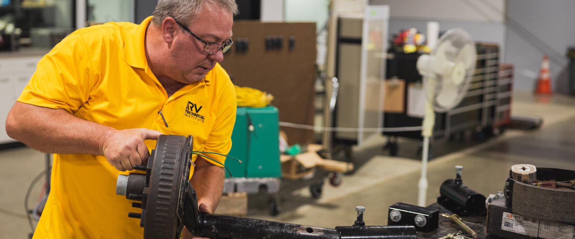 Technician working on an axel