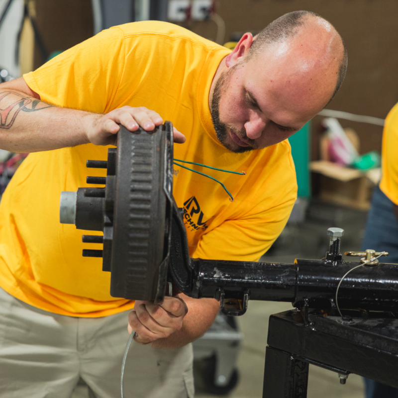 Man working on axel 